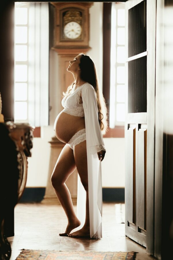 Pregnant Woman Wearing White Robe Mom