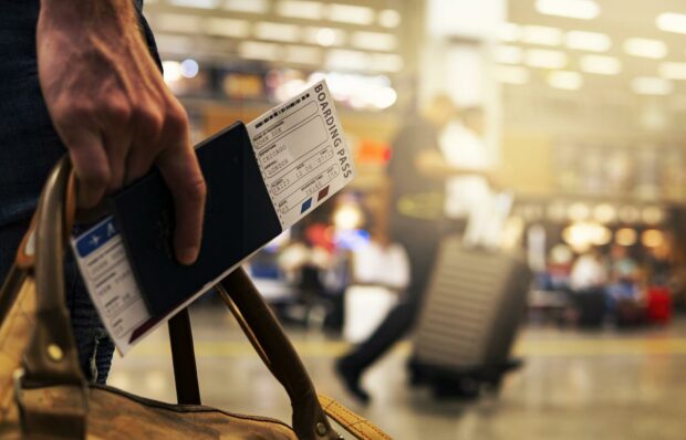 Traveler With A Printed Boarding Pass And Passport For Security Checkpoints