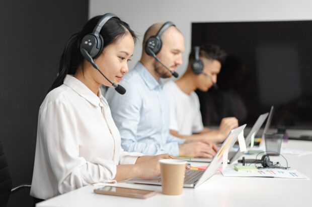 Customer Service Operators Taking Phone Calls From Customers