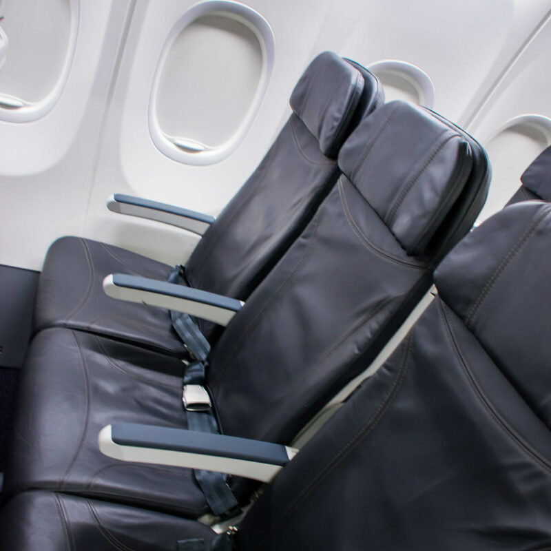 Airplane Middle Seat - A Row Of Coach Class Seats In An Alaska Airlines 737-900Wl