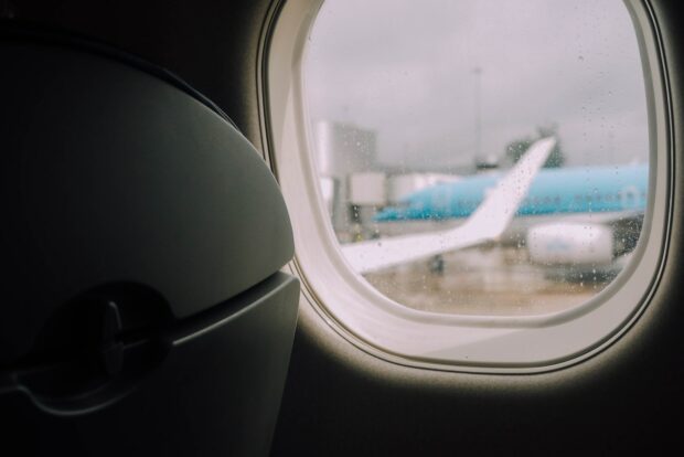 Airplane Wing Seats - Closeup Photography Of Airplane Windopw