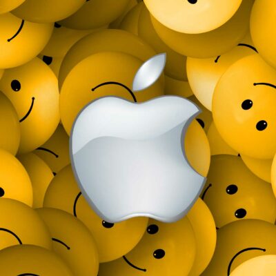 Apple logo surrounded by yellow smiley faces from Blooper Reel.