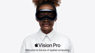 Pre-Orders For The Apple Vision Pro VR Headset Are Already Mostly Sold Out - A woman wearing the Apple Vision Pro VR Headset, available for pre-orders, immerses herself in a virtual reality experience.