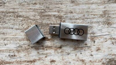 Free Audi USB flash drive on a wooden table
