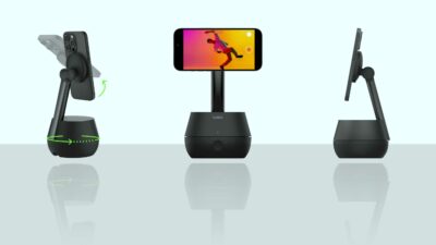 Belkin Stage Stand - Three black phone stands are shown, each holding a smartphone. The Belkin Auto-Tracking Stand Pro has adjustable angles and holds the phones in landscape orientation, seamlessly integrating iPhone camera tracking for enhanced usability.