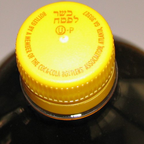 Bottle Of Coke With Yellow Cap