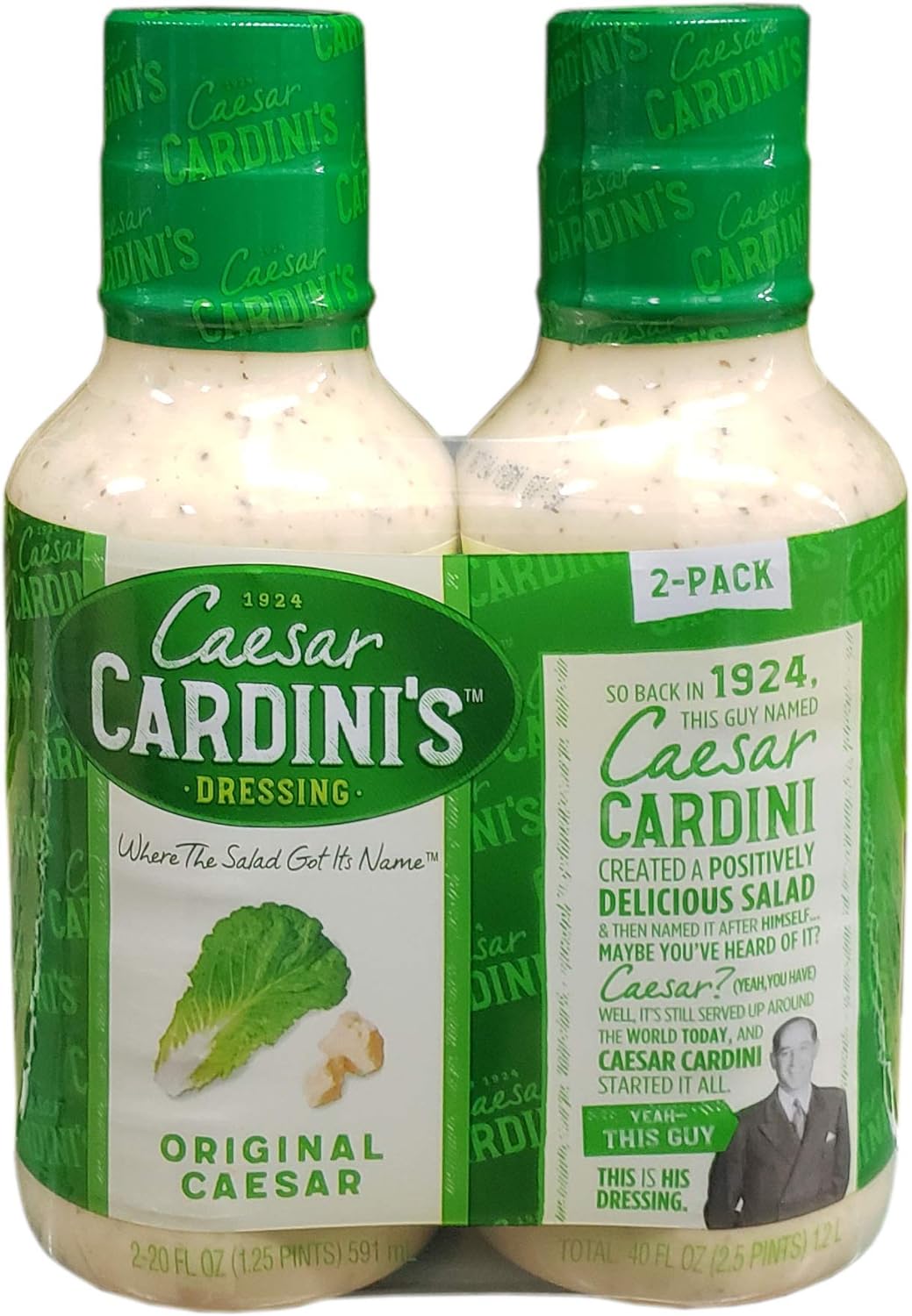 Two Bottles Of Caesar Cardini'S Original Caesar Dressing In Green And White Packaging. Text On The Packaging Answers, &Quot;Who Created The First Caesar Salad?&Quot; And Includes Historical Information About Its Origins. Perfect For Making An Authentic Caesar Salad With Anchovies.