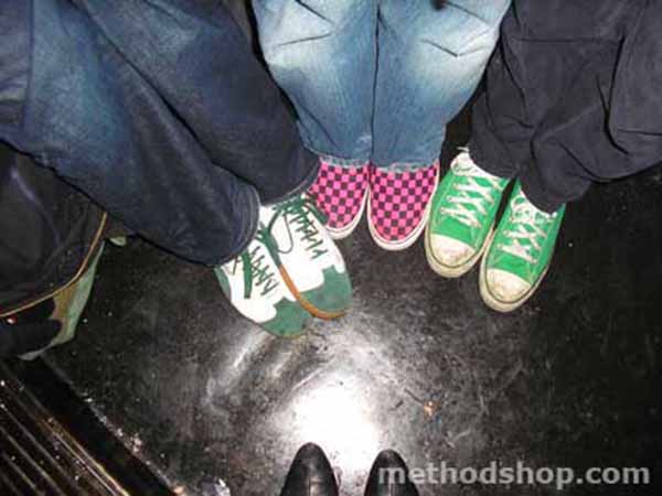 The Colorful Shoes Of The Chalets -- A Group Of People Wearing Green Converse Shoes.