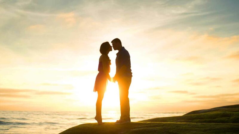 Couple Enjoying A Romantic Sunset