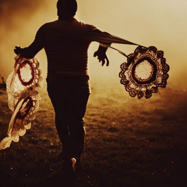 Man Holing Running Away From Bloodstained Doilies, Dramatic, Film Grain, Golden Hour, Backlit, Style Of A 1970S Horror Movie