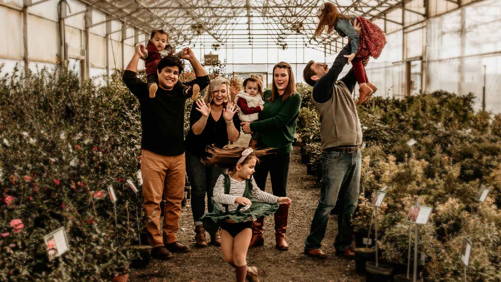 Extended Family In A Greenhouse
