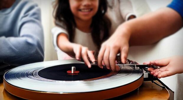 Family Using A Record Player