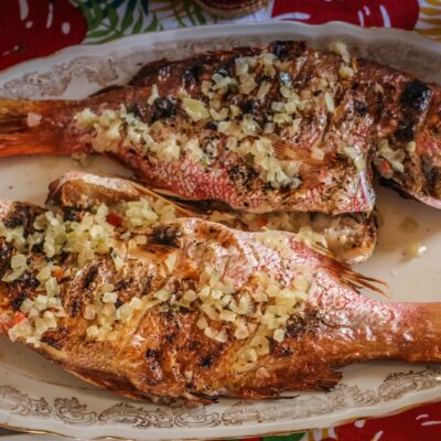 A Festive Christmas Eve Dinner Featuring Two Grilled Fish As Part Of The Feast Of The Seven Fishes Tradition.