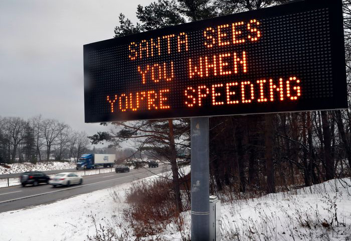 A Hilarious Sign Proclaiming That &Quot;Santa Sees You When You'Re Speeding&Quot;, Perfect For Those Who Love Funny Highway Signs.