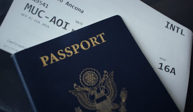 Us Passport Booklet On Top Of White Paper
