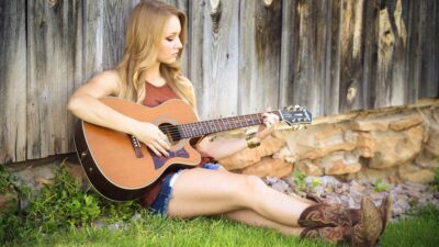 Woman playing an acoustic guitar