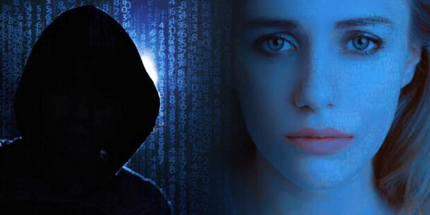 Picture Of A Creepy Hooded Hacker And A Sad Woman