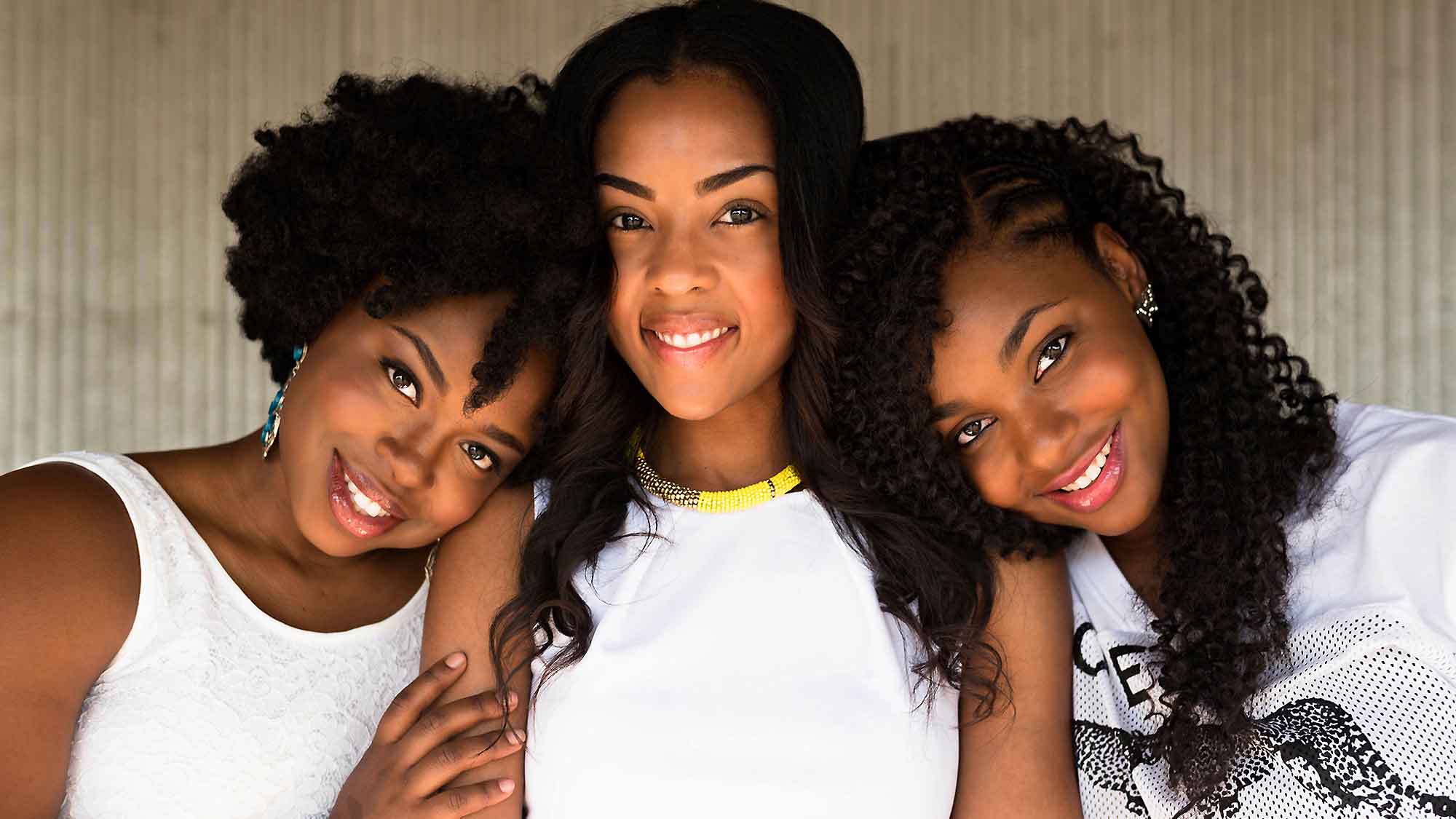 Three Happy Black Women Smiling