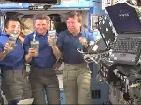 Astronauts Celebrate New NASA Urine Recycler WIth A Bag Of Recycled Urine