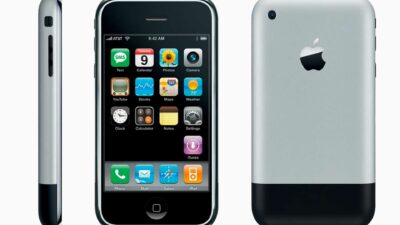The iPhone 1G is shown next to a white background.
