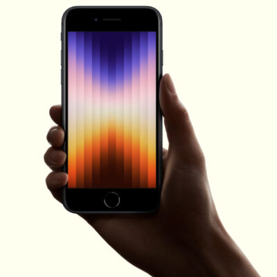 Iphone Se: A Hand Holding A Smartphone With A Colorful Gradient Screen Displaying Vertical Bars, Possibly The Upcoming Iphone Se 4 Aiming To Capture The Mid-Range Smartphone Market.