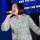 Karaoke Singer - woman in black and white long sleeve shirt singing
