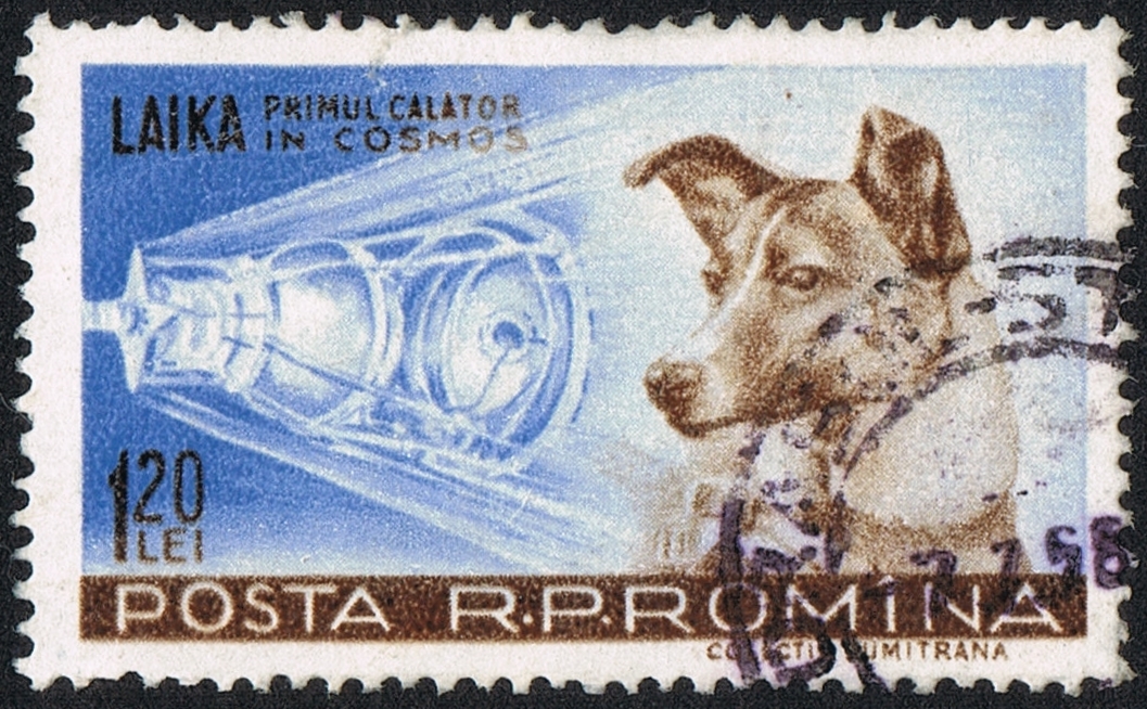 A Romanian Postage Stamp Celebrates Laika, The Soviet Space Dog And First Animal To Orbit Earth, With A Stunning Cosmos-Inspired Spacecraft Illustration. The Stamp Carries A Valued Denomination Of 120 Lei.