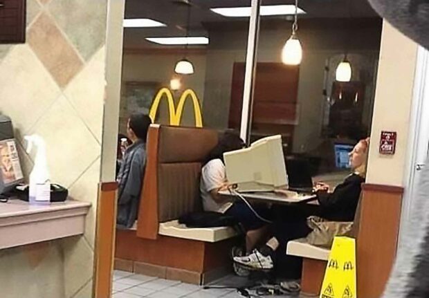 Woman Uses Free Mcdonald's Wifi With A Full Desktop Computer And Monitor