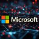 The Microsoft logo shines on a dark background, illuminated by blue and red network-style lights, symbolizing its leadership in AI infrastructure.