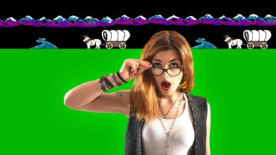 A Girl With Glasses Is Standing In Front Of A Green Background While Playing The Oregon Trail Game.