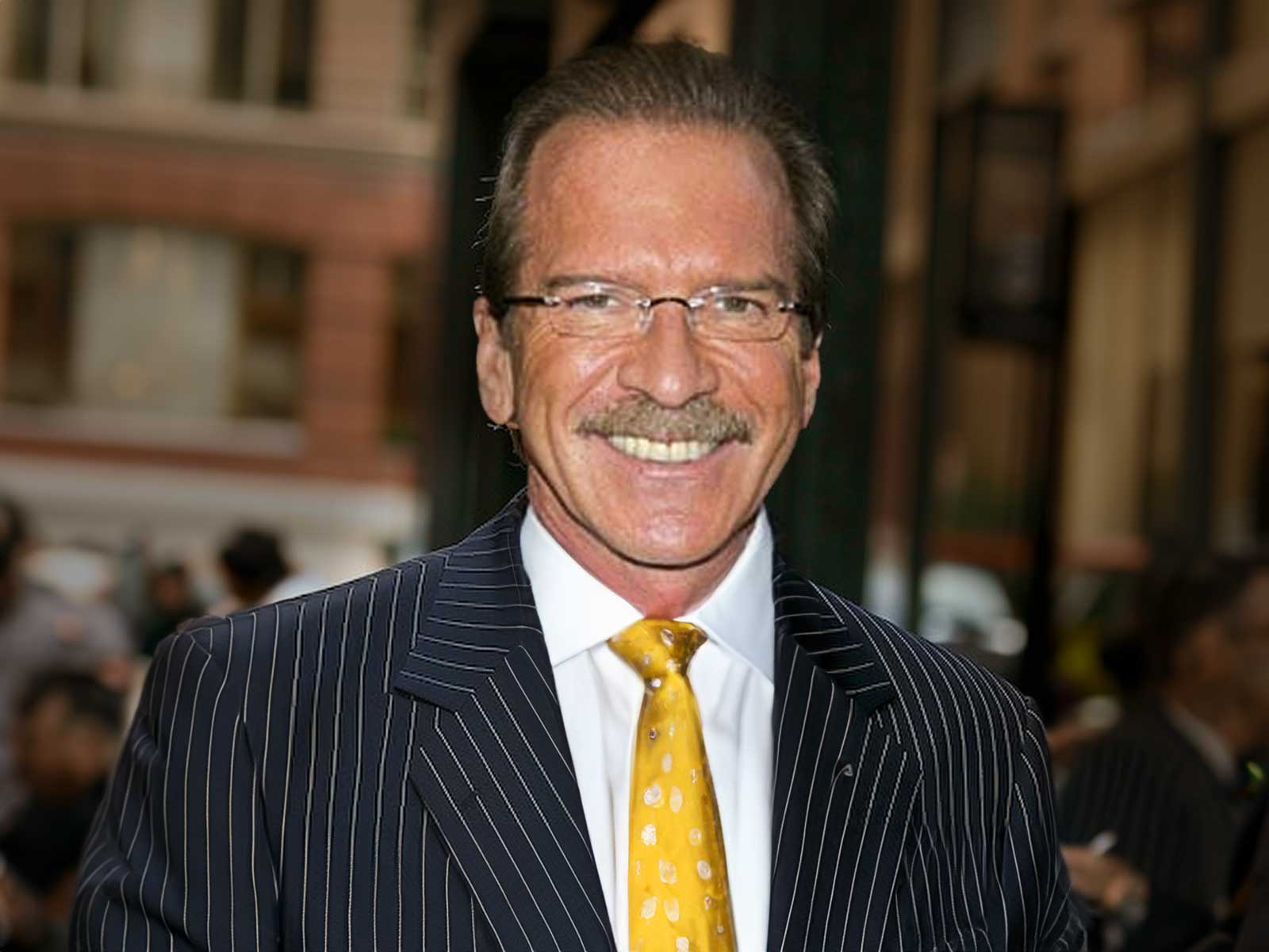 Pat O'Brien With Glasses, A Mustache, And Greying Hair Smiles While Wearing A Pinstripe Suit And Blue Tie Outdoors, Reminiscent Of The Composed Image Pat O'Brien Held Before The Scandal.