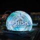 Phish Sphere Vegas Shows - Night View Of A Spherical Building Illuminated With The Logo &Quot;Phish Live At Sphere&Quot; In Front Of The Las Vegas Skyline.