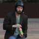 Sad Keanu Reeves With Helmet And Juice