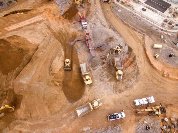 Aerial Photography Of Dump Trucks Sand Mining