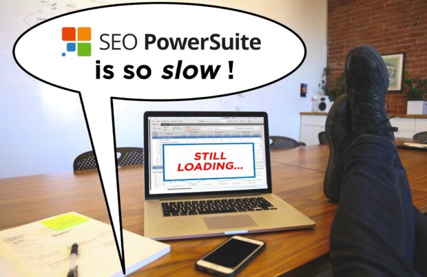 A Man Sitting At A Desk With A Laptop That Says Seopowersuite Is Slow.