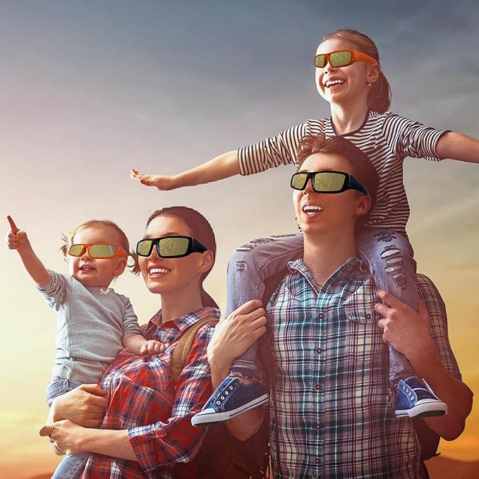 Plastic Frame Solar Eclipse Glasses Approved 2024 In Sturdy Style - A Family Enjoying A Sunny Day Outdoors On April 8, With Two Children On Their Parents' Shoulders Wearing Sunglasses.
