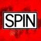 Spin Magazine - A red background with the word "SPIN" in bold black letters centered inside a white rectangular box, capturing the essence of Spin Magazine's relaunch as a multimedia music brand.