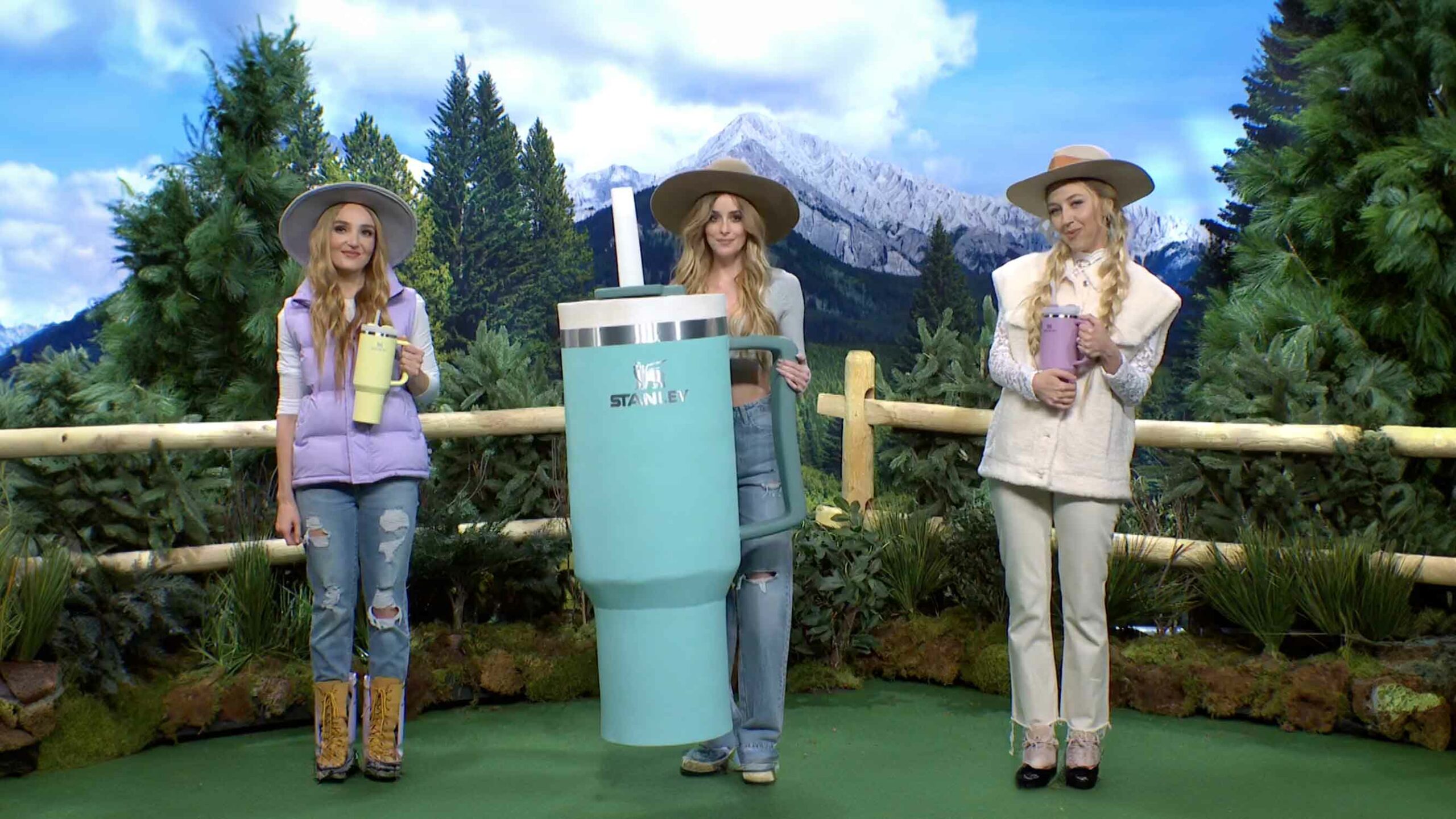 Big Dumb Cups, Hats, Cars, And Excessive Consumerism -- Three Girls In Hats Standing Next To A Large Container Known As A Big Dumb Cup Or The Stanley Cup.