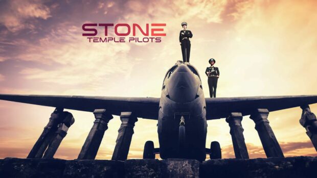 Stone Temple Pilots Standing On Top Of A Stone Temple