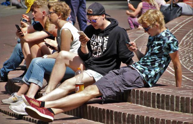 Group Of Teens On Smartphones