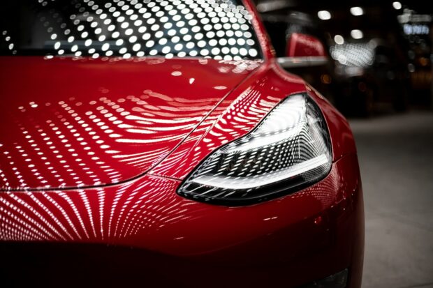 Close-Up Photo Of A Red Tesla Car