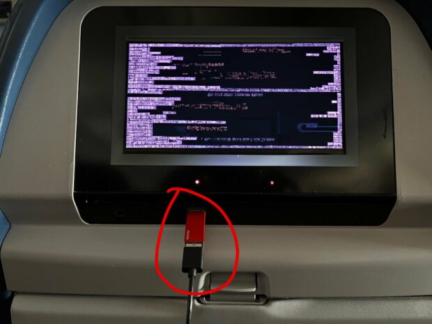 A Computer Screen Showing A Hacker Trying To Juice Jack An Iphone Using A Usb Port But A Usb Data Blocker Is Blocking The Hacker.
