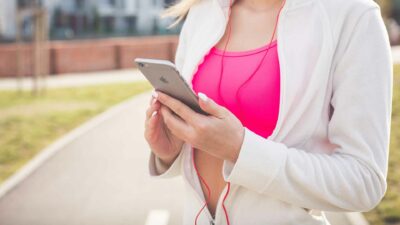 Woman Using Smartphone During Workout