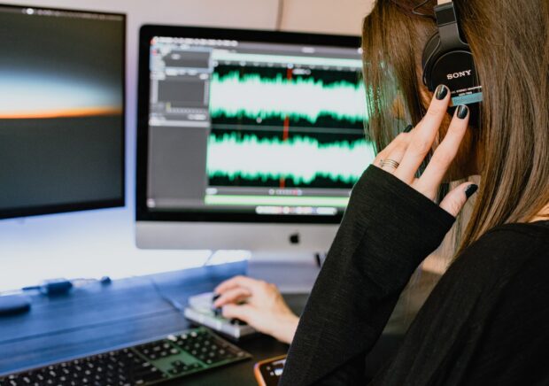 Woman Editing Computer Audio